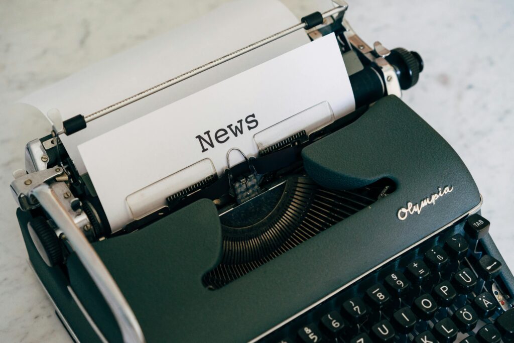 pexels-photo-4057663-4057663 Close-up of an antique typewriter with 'News' on paper.