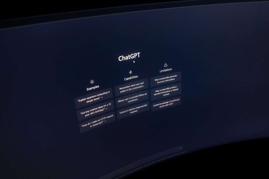 Close-up von a computer screen displaying ChatGPT interface in a dark setting.
