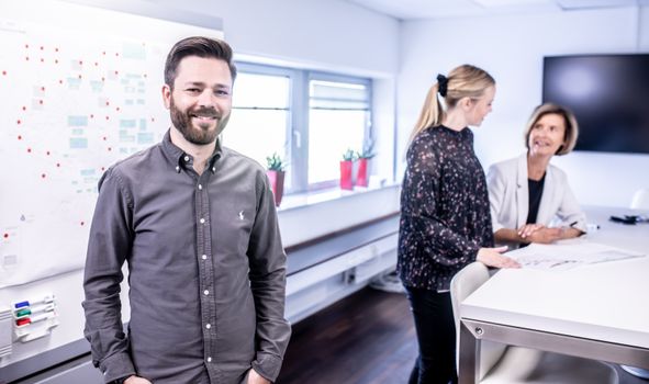 pexels-photo-13820229-13820229-1 Smiling team meeting in office space with collaborative atmosphere and modern interior.